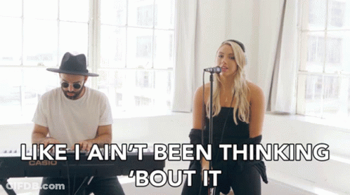A Man And A Woman Singing In Front Of A Keyboard That Says Casio GIF