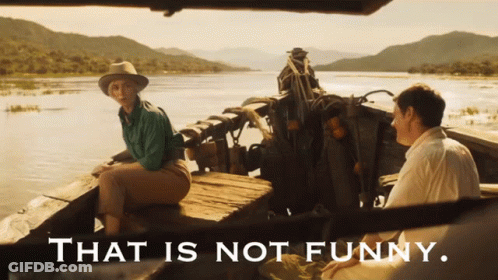 A Man And A Woman Sit In A Boat With The Words That Is Not Funny Below Them GIF