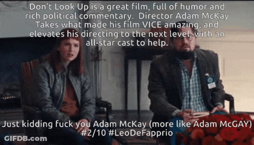 A Man And A Woman Sit Next To Each Other With A Caption That Says " Don T Look Up " GIF