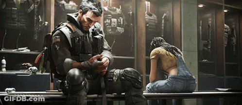 A Man And A Woman Sit On A Bench In A Locker Room . GIF
