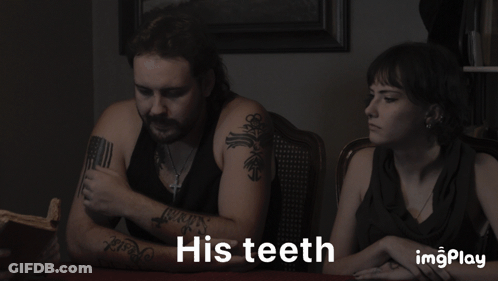 A Man And A Woman Sitting At A Table With The Words His Teeth On The Bottom GIF