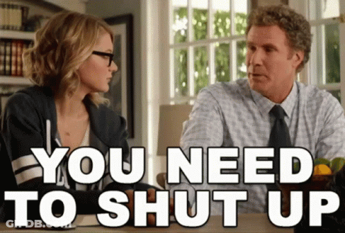 A Man And A Woman Sitting At A Table With The Words You Need To Shut Up GIF