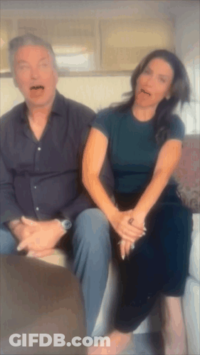 Man And Woman Sitting Together Woman Sticking Tongue GIF