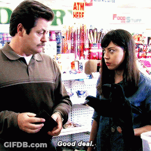 A Man And A Woman Standing In Front Of An Atm Sign GIF