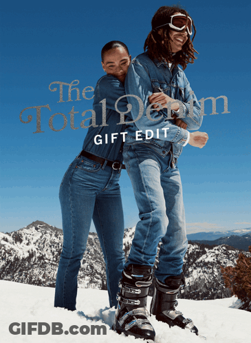 A Man And A Woman Standing In The Snow With The Words The Total Denim Gift Edit GIF