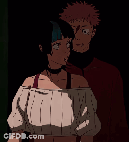 A Man And A Woman Standing Next To Each Other GIF