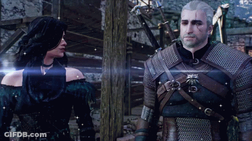 A Man And A Woman Standing Next To Each Other GIF