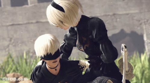 A Man And A Woman Standing Next To Each Other GIF