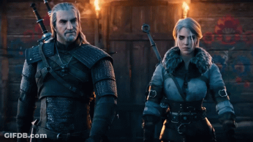 A Man And A Woman Standing Next To Each Other With Swords GIF
