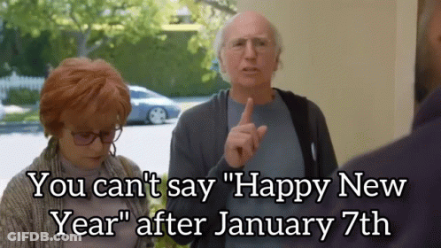 A Man And A Woman Standing Next To Each Other With The Caption " You Can 'T Say Happy New Year " GIF