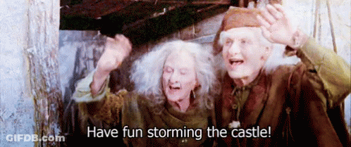 A Man And A Woman Standing Next To Each Other With The Words Have Fun Storming The Castle Written Below Them GIF