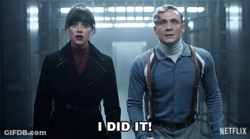 A Man And A Woman Standing Next To Each Other With The Words I Did It Written On The Screen GIF