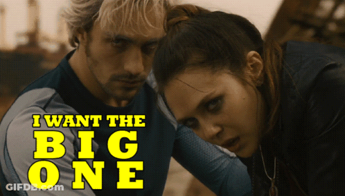A Man And A Woman Standing Next To Each Other With The Words " I Want The Big One " On The Bottom GIF