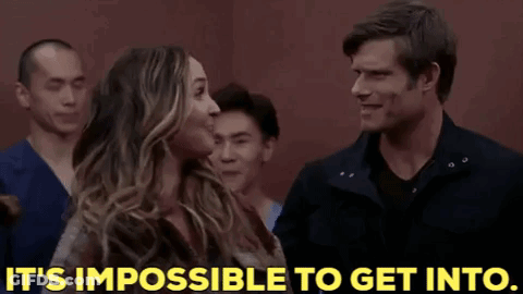 Man And Woman Standing Next To Each Other Saying It's Impossible To Get In GIF