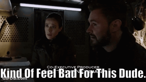 A Man And A Woman Standing Next To Each Other With The Words Kind Of Feel Bad For This Dude GIF