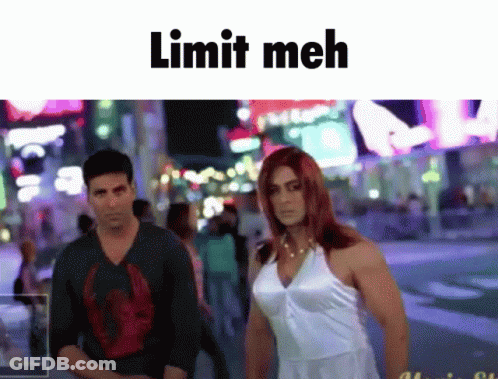A Man And A Woman Standing Next To Each Other With The Words Limit Meh Written Above Them GIF