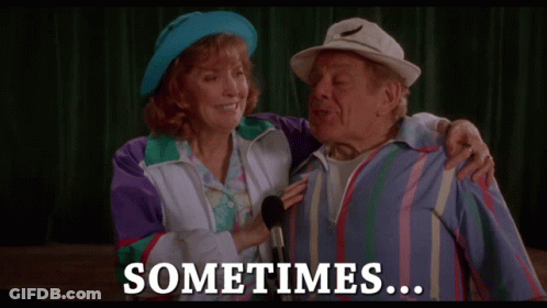 A Man And A Woman Standing Next To Each Other With The Words " Sometimes " On The Bottom GIF