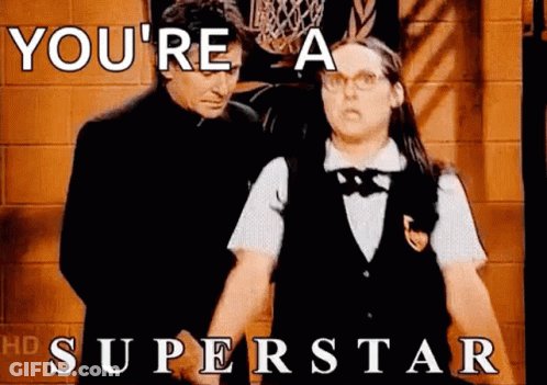 A Man And A Woman Standing Next To Each Other With The Words `` You 'Re A Superstar '' GIF