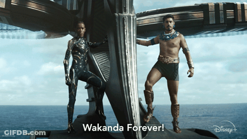 A Man And A Woman Standing Next To Each Other With Wakanda Forever Written In The Corner GIF