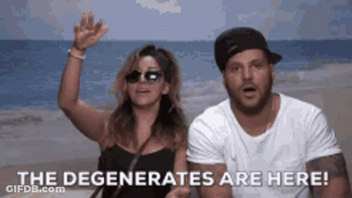 A Man And A Woman Standing On A Beach With The Words " The Degenerates Are Here " GIF