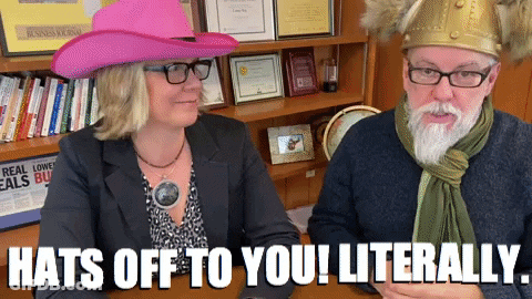 A Man And A Woman Wearing Hats With The Words Hats Off To You Literally On The Bottom GIF