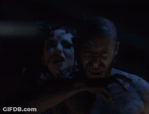 A Man And A Woman With Blue Painted Faces GIF