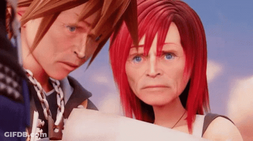 A Man And A Woman With Red Hair Are Standing Next To Each Other In A Video Game . GIF