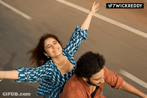 A Man And A Woman With Their Arms Outstretched And The Words 7Wickreddy Below GIF