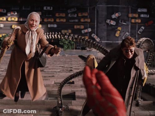 A Man And An Elderly Woman Are Walking Down A Set Of Stairs GIF
