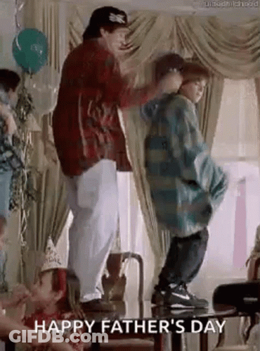 A Man And Two Children Are Dancing At A Father 'S Day Party In A Living Room . GIF
