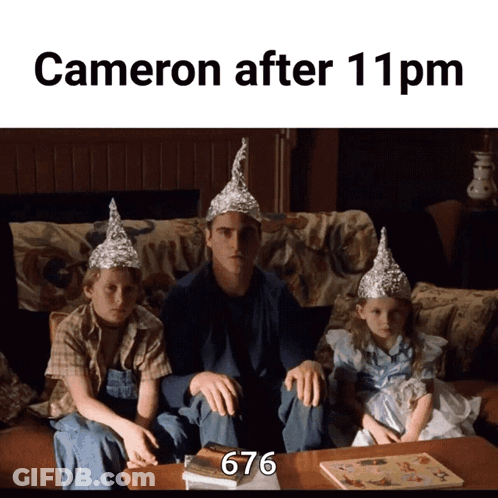 A Man And Two Children Wearing Aluminum Foil Hats Are Sitting On A Couch With The Caption Cameron After 11 Pm GIF