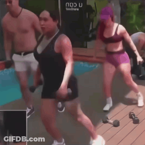 A Man And Two Women Are Doing Exercises In Front Of A Machine That Says Ndu GIF