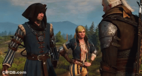 A Man And Two Women Are Standing In A Field And Talking To Each Other GIF