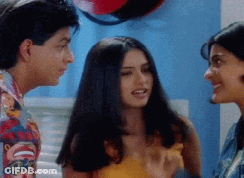 A Man And Two Women Are Standing Next To Each Other And Talking To Each Other . GIF