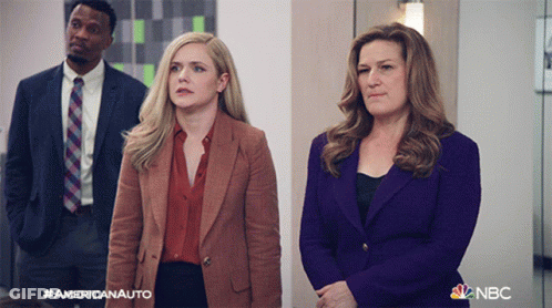 Man And Two Women Standing Next To NBC Logo GIF