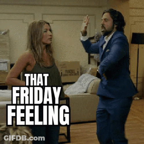 A Man And Woman Are Dancing In A Living Room . GIF