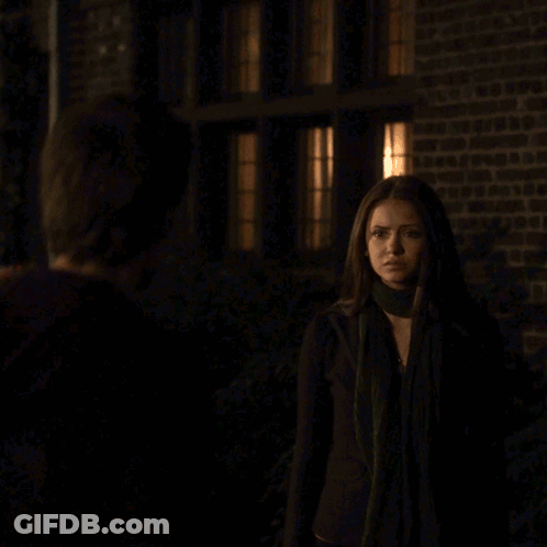 A Man And Woman Are Kissing In The Dark GIF