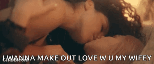 A Man And Woman Are Kissing On A Bed With The Words `` I Wanna Make Out Love W U My Wifey '' GIF