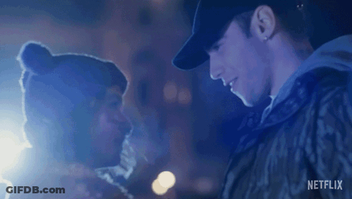 A Man And Woman Are Looking Into Each Other 'S Eyes . GIF
