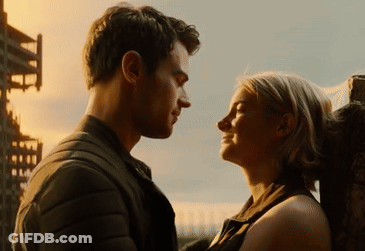 A Man And Woman Are Looking Into Each Others Eyes GIF