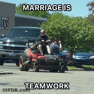 A Man And Woman Are Riding A Lawn Mower With The Words Marriage Is Teamwork Below Them GIF