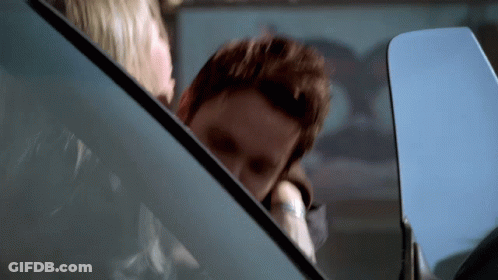 Man And Woman Sitting In Car Woman Looking Out Window GIF