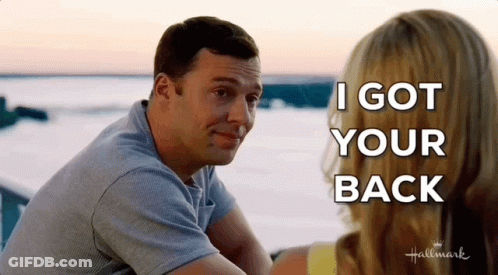 A Man And Woman Are Sitting Next To Each Other And The Man Is Saying I Got Your Back GIF