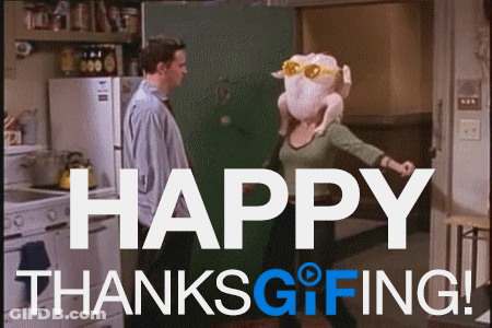 A Man And Woman Are Standing In A Kitchen With The Words Happy Thanksgiving In The Corner GIF