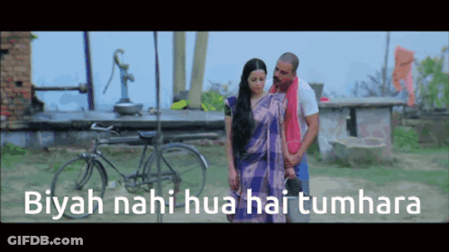 A Man And Woman Are Standing In Front Of A Bicycle With The Words Biyah Nahi Hua Hai Tumhara Written On The Bottom GIF