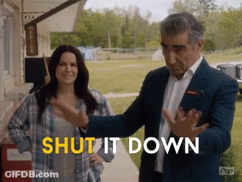 A Man And Woman Are Standing Next To Each Other And The Man Is Saying Shut It Down . GIF