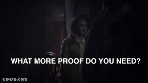 A Man And Woman Are Standing Next To Each Other With The Words What More Proof Do You Need Below Them GIF