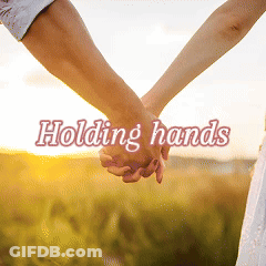 A Man And Woman Holding Hands With The Words Holding Hands Below Them GIF