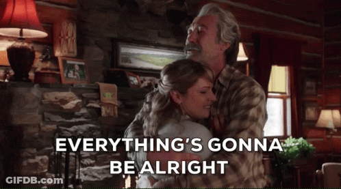 A Man And Woman Hugging In A Living Room With The Words Everything 'S Gonna Be Alright Below Them GIF