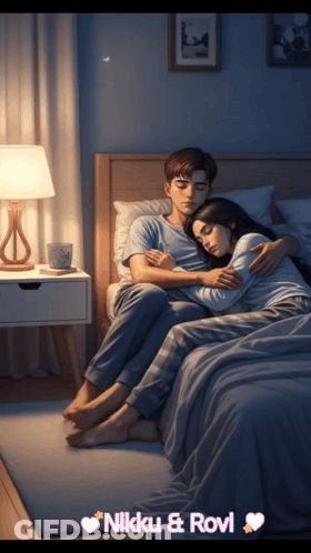 A Man And Woman Hugging On A Bed With The Name Nikki & Rovi On The Bottom Right GIF